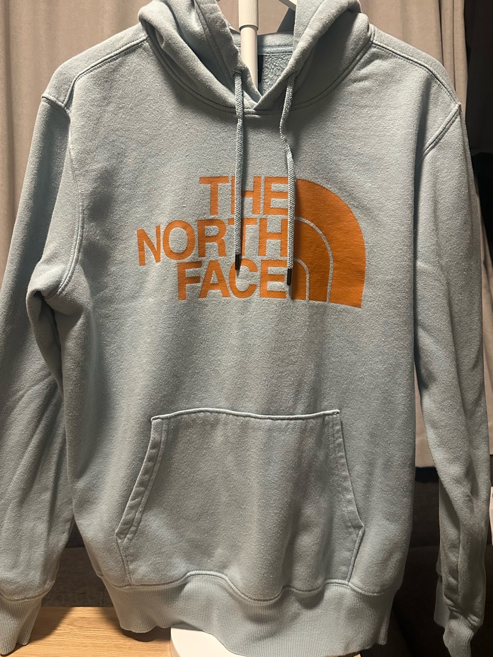 The North Face Men’s Light Blue Crewneck Hoodie with Orange Logo